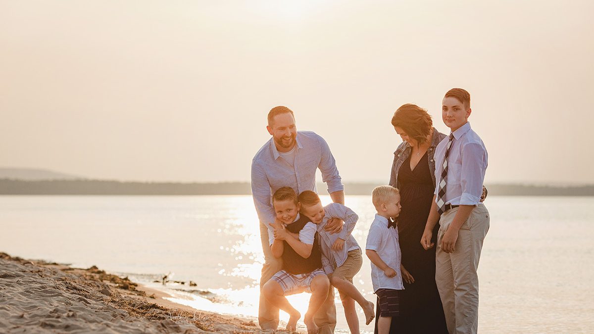family photo session at au train beach on shores of lake superior in munising michigan